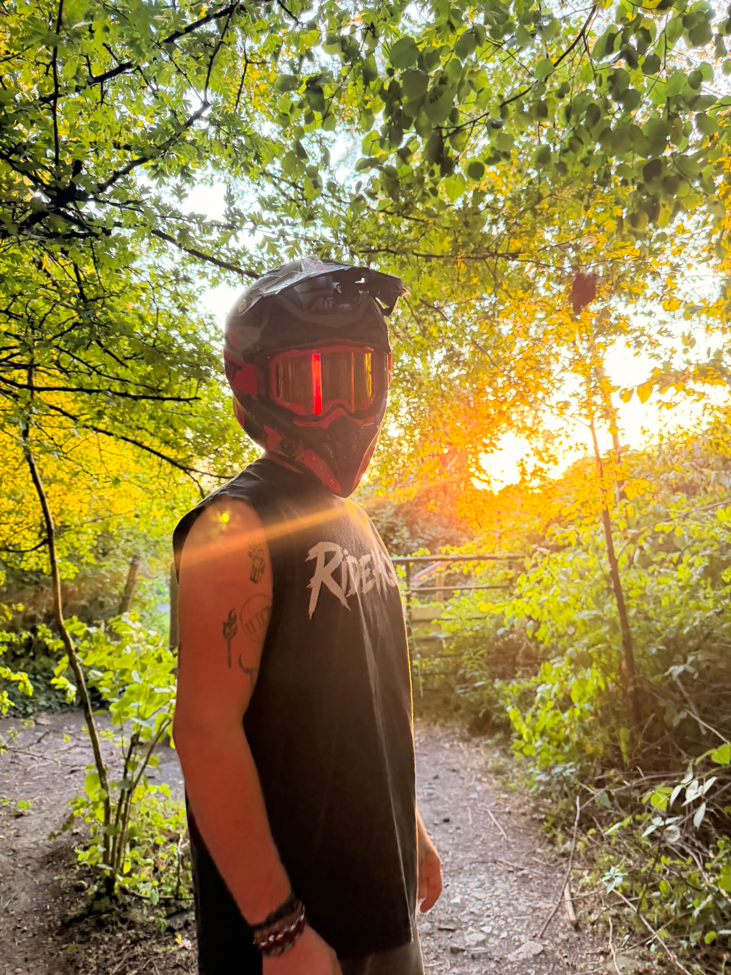 RIDEHQ tank top on the trail at sunset